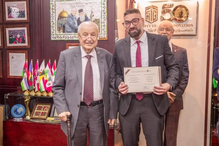 Yazan Ibrahim receiving a certificate at a ceremony